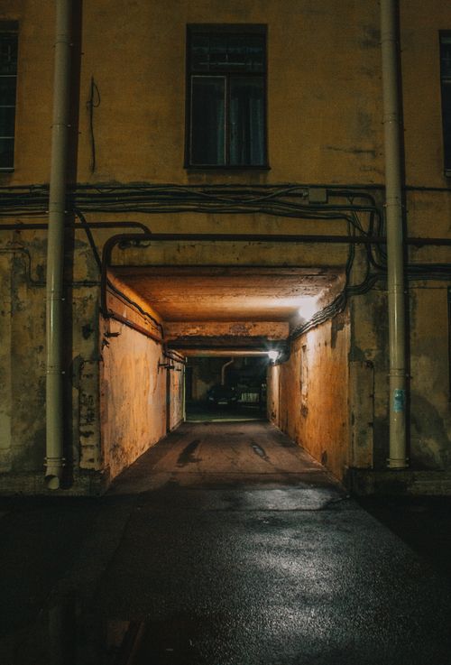 Free Moody urban tunnel in Saint Petersburg, Russia, showcasing an eerie and decayed atmosphere. Stock Photo