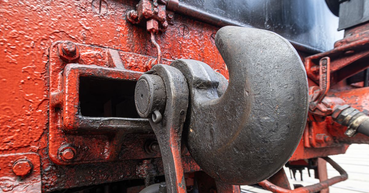 Detailed view of a vintage train coupling mechanism in Sonneberg, Germany showcasing industrial history.