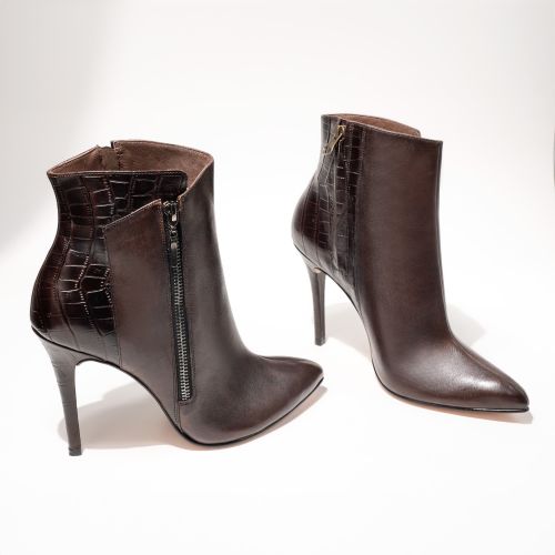 Free Sophisticated dark brown leather ankle boots with zipper on a white background. Stock Photo