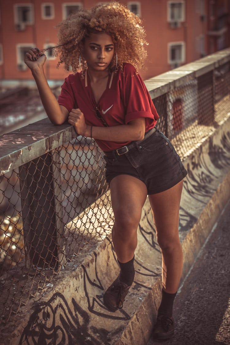 Photo Of Woman Leaning On Railing