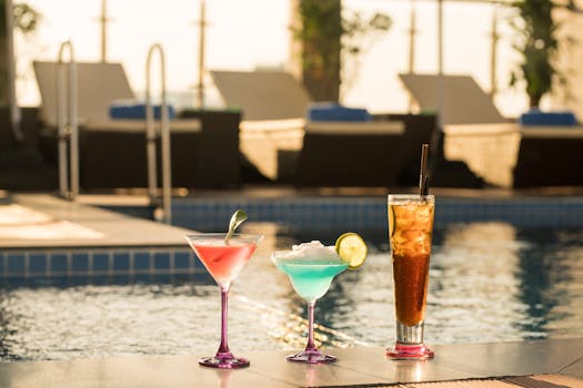 Colorful cocktails by a poolside under the afternoon sun in Phnom Penh.