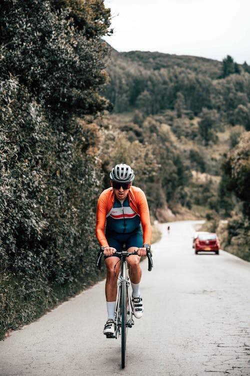 Cyclist Climbing Hill