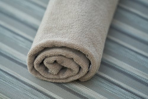 Free Rolled Gray Towel in Closeup Photo Stock Photo
