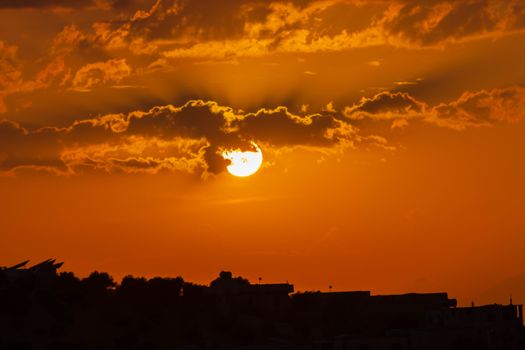 Stunning sunset with silhouette in Aaqrabâte, Syria. Dramatic and scenic sky.