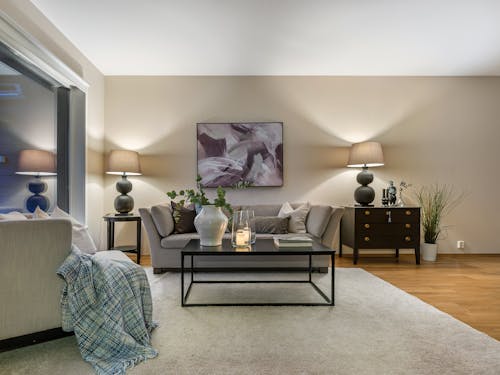 A living room with a large window and a couch