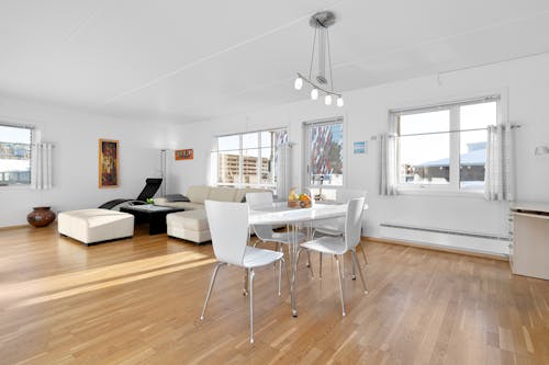 A white and wood flooring in a living room