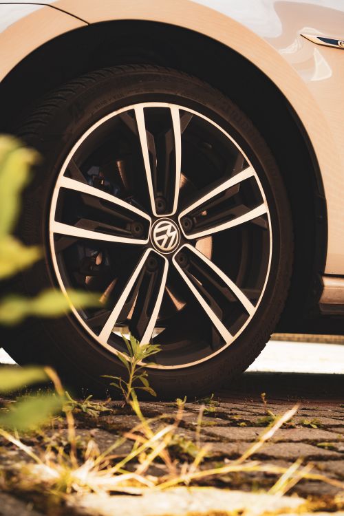 Free Detailed view of a Volkswagen alloy wheel on a sunny day. Stock Photo