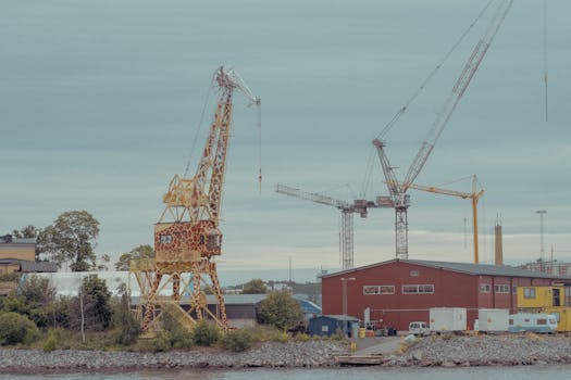 Industrial crane and exterior building view in Stockholm, Sweden featuring machinery.