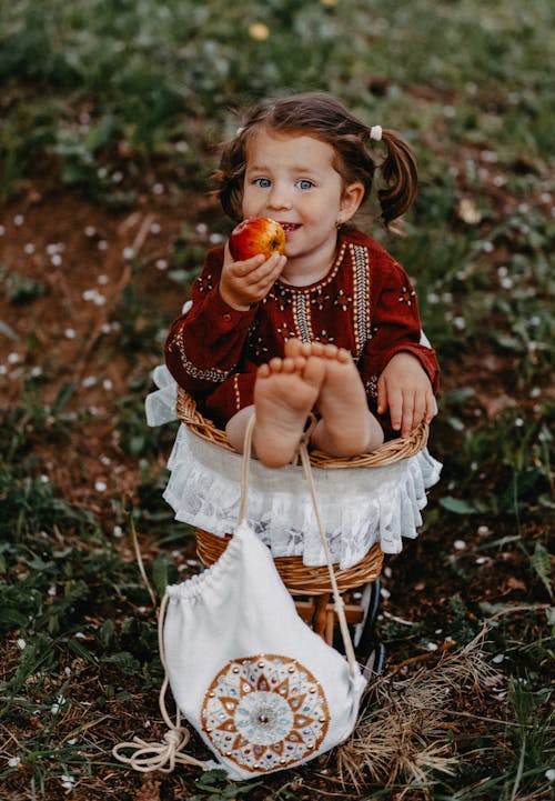 Free little kid in the garden Stock Photo