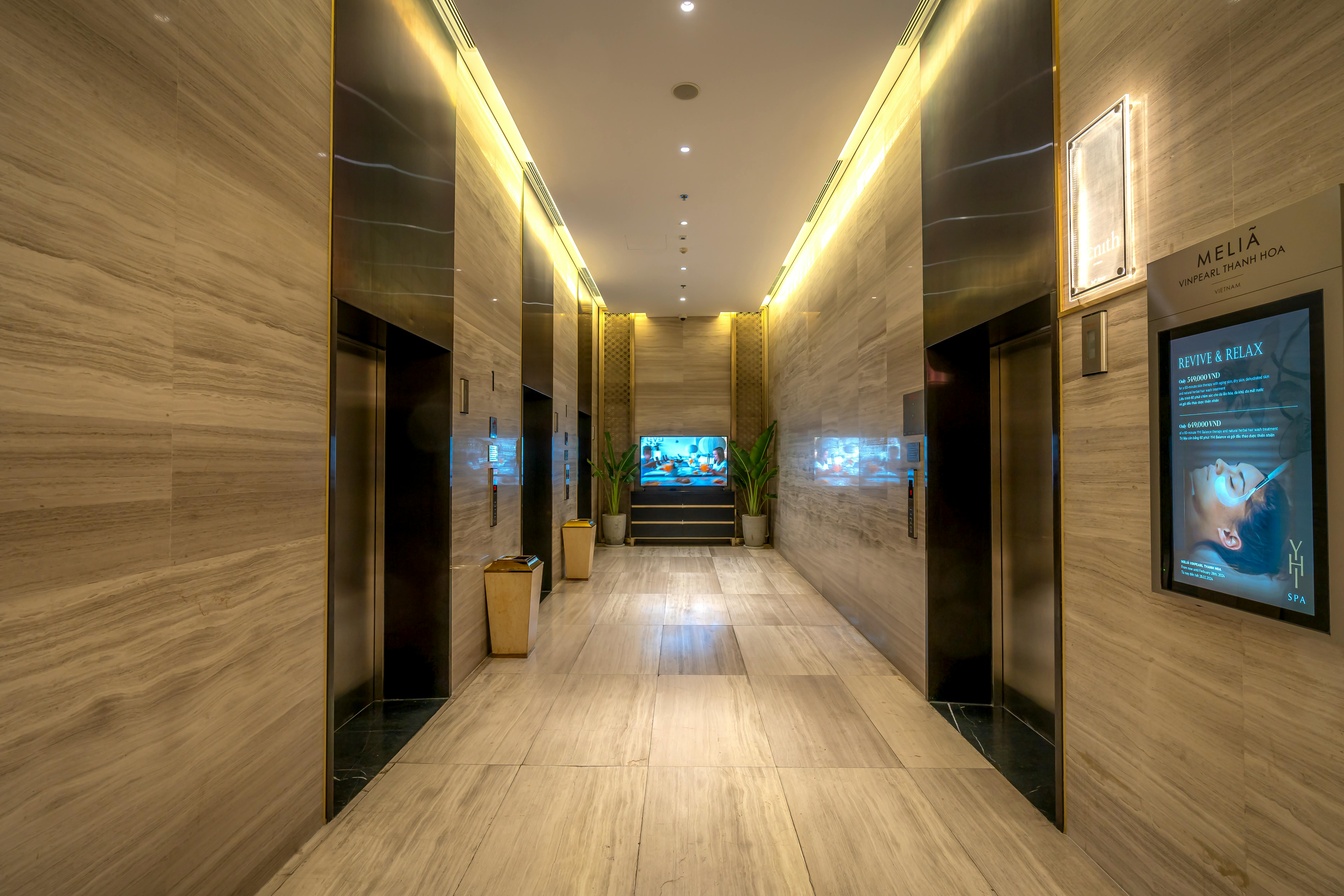 A hotel developer reviewing design plans for custom hotel furniture wholesale, ensuring brand consistency and guest experience.