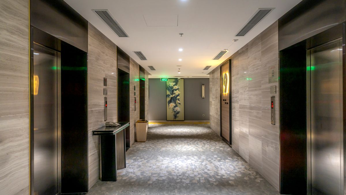 A hotel hallway with elevators