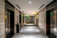 Hotel lift lobby with stone floor — photo by Quang Nguyen Vinh on Pexels
