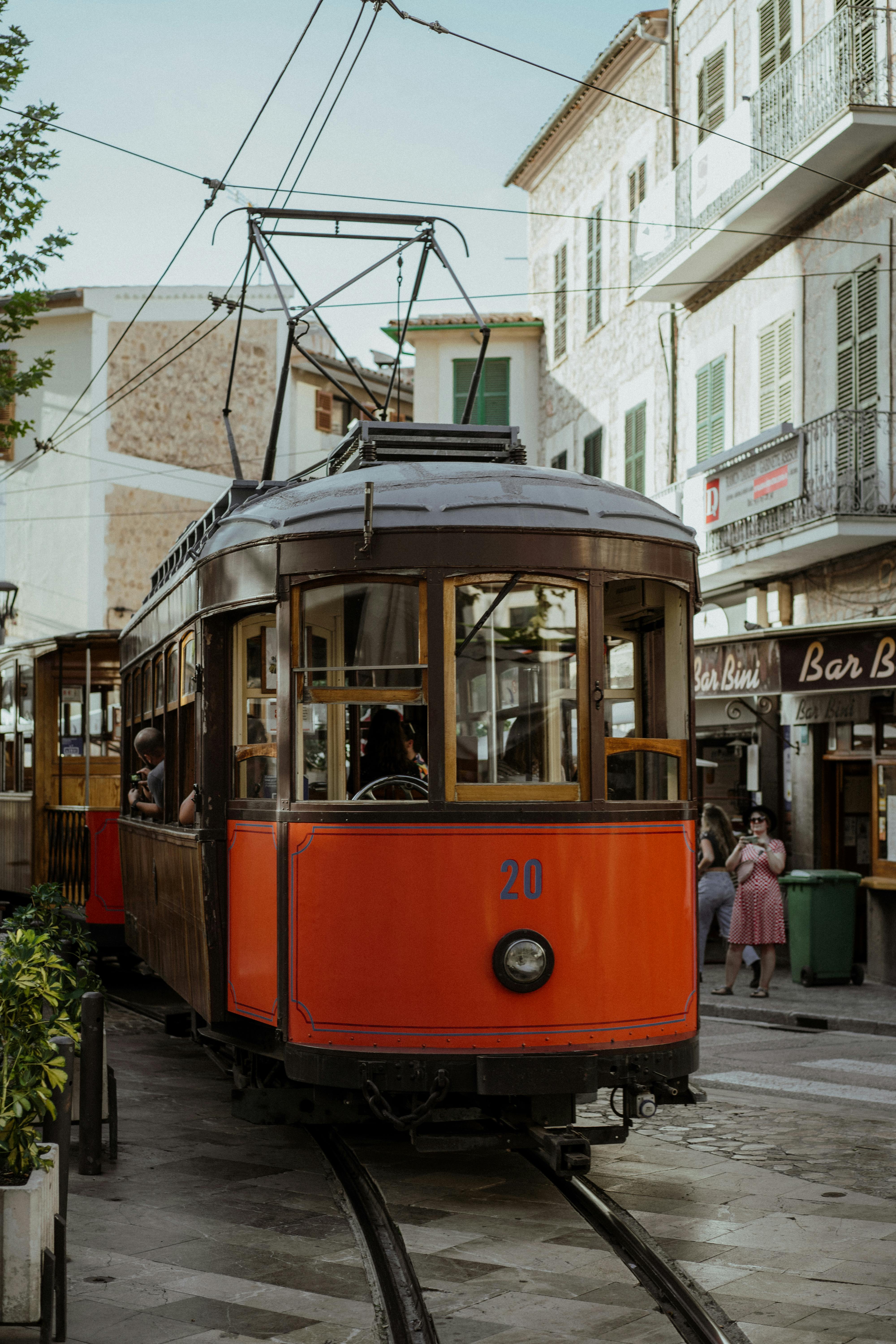 Charming Sóller street with a classic tram, capturing travel and local culture.