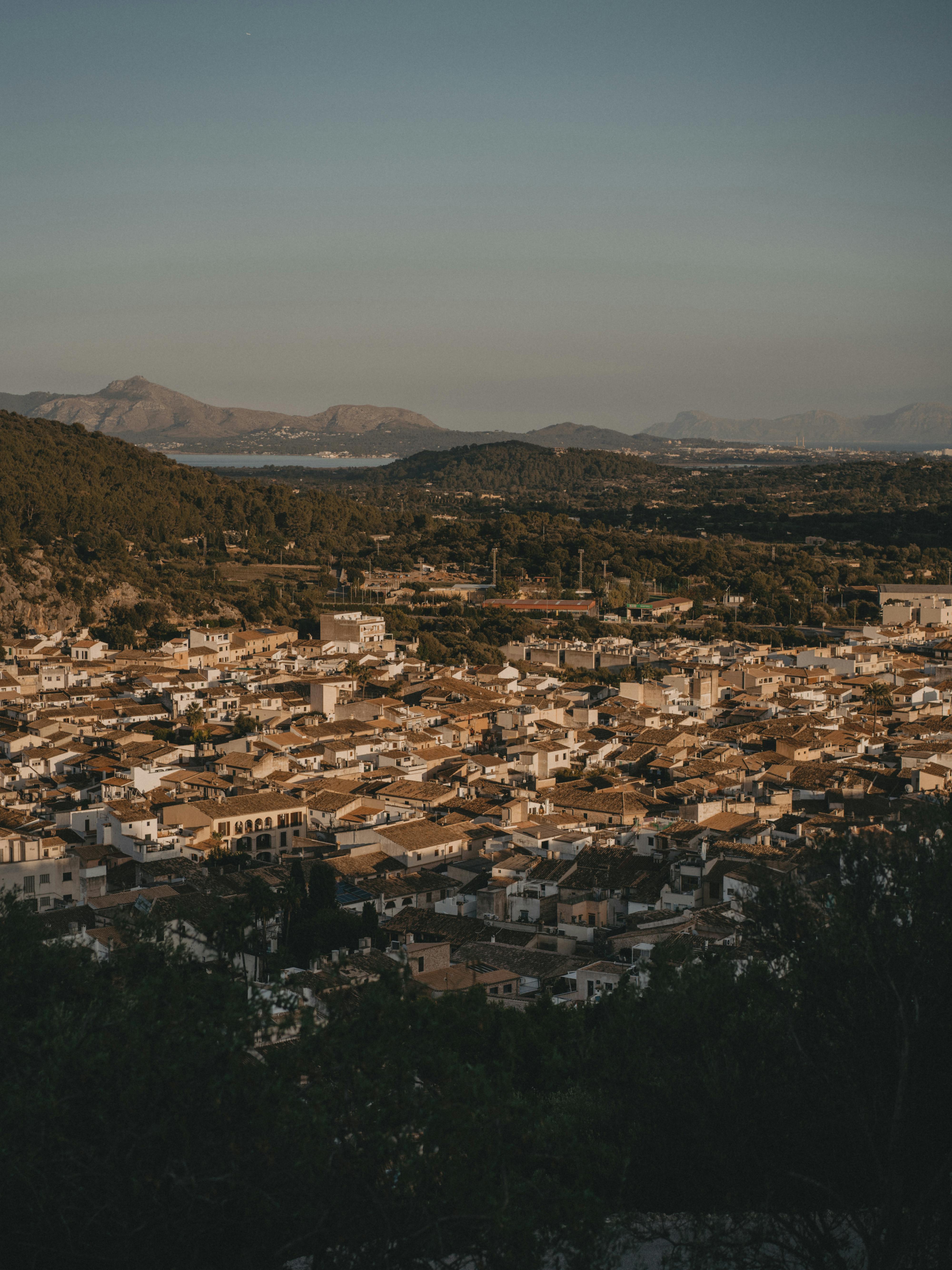 Stunning aerial view of Palma, Mallorca with historic architecture and scenic landscape at sunset.