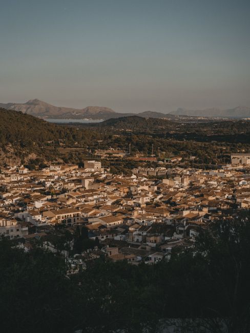Stunning aerial view of Palma, Mallorca with historic architecture and scenic landscape at sunset.