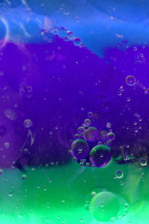 Free Colorful abstract image with blue, violet, and green bubbles, creating a dynamic visual. Stock Photo