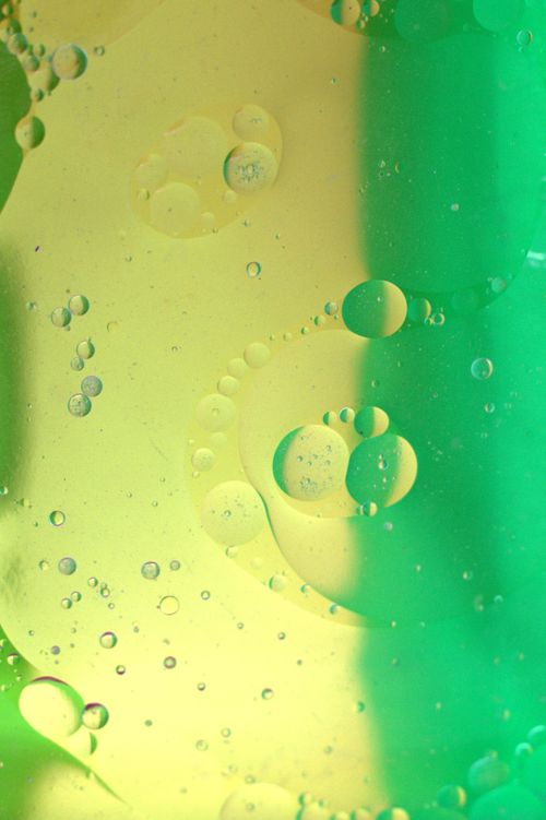 Free Dynamic abstract image of colorful oil bubbles, perfect for backgrounds or mobile wallpapers. Stock Photo
