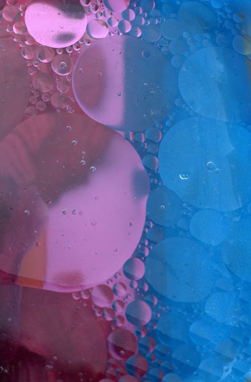Free Colorful abstract image of oil and water with pink and blue hues. Stock Photo