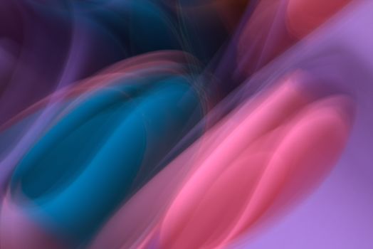 Vibrant abstract image with dynamic motion blur of blue and pink hues.