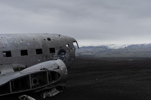 Free Rustic airplane wreckage set against the stark Icelandic terrain. Stock Photo