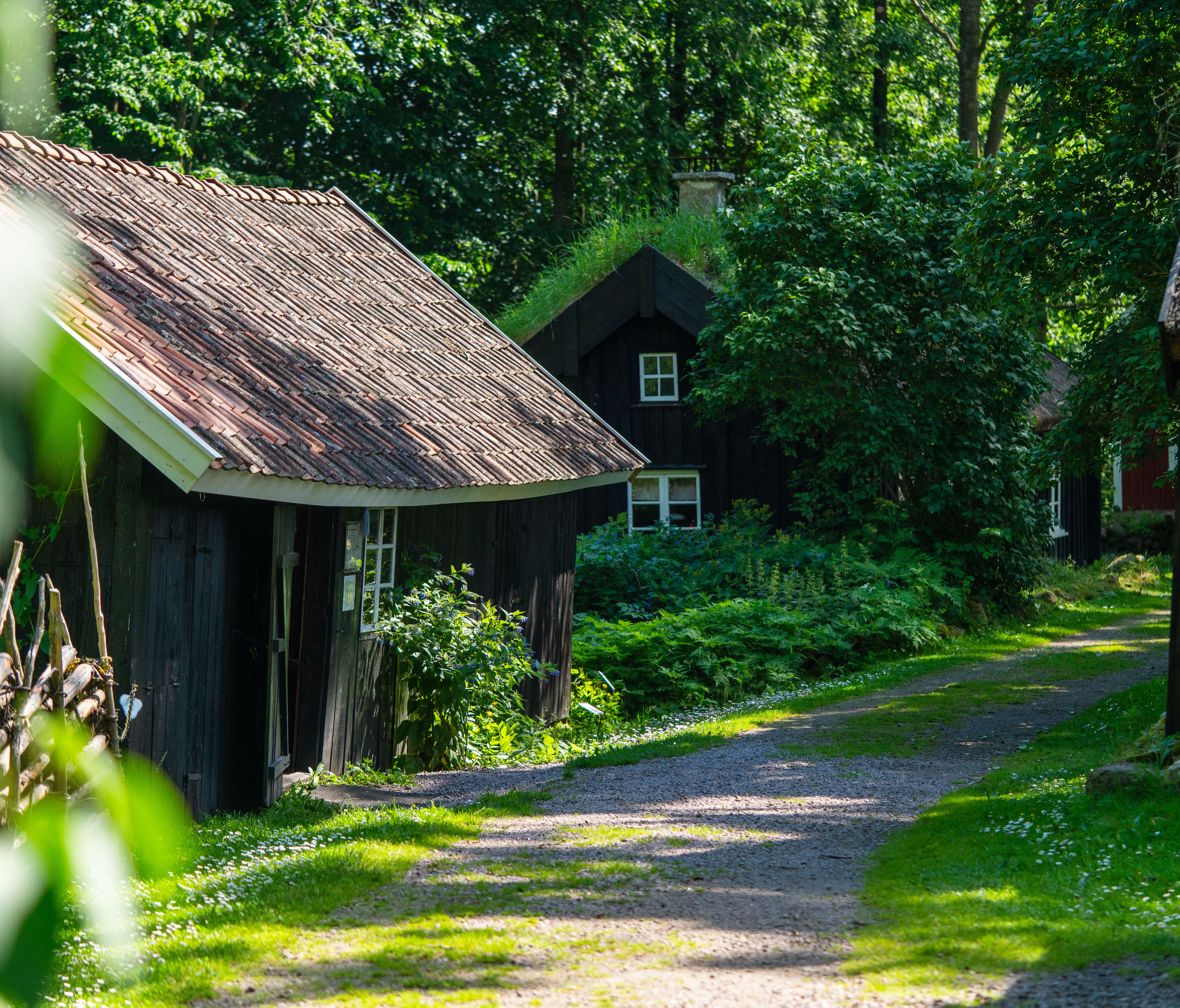 Brown Wooden House Near the Creek With a Bridge · Free Stock Photo