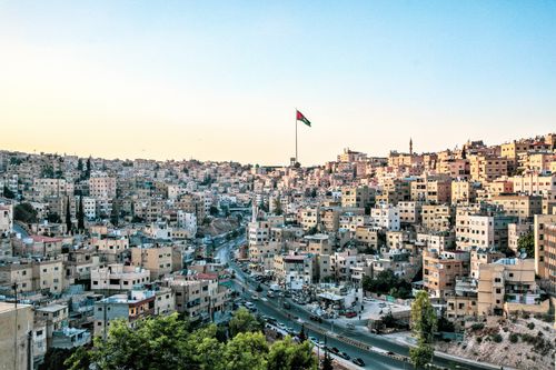 Free High angle view of Amman, Jordan with its distinct skyline and prominent flag under a clear sky. Stock Photo