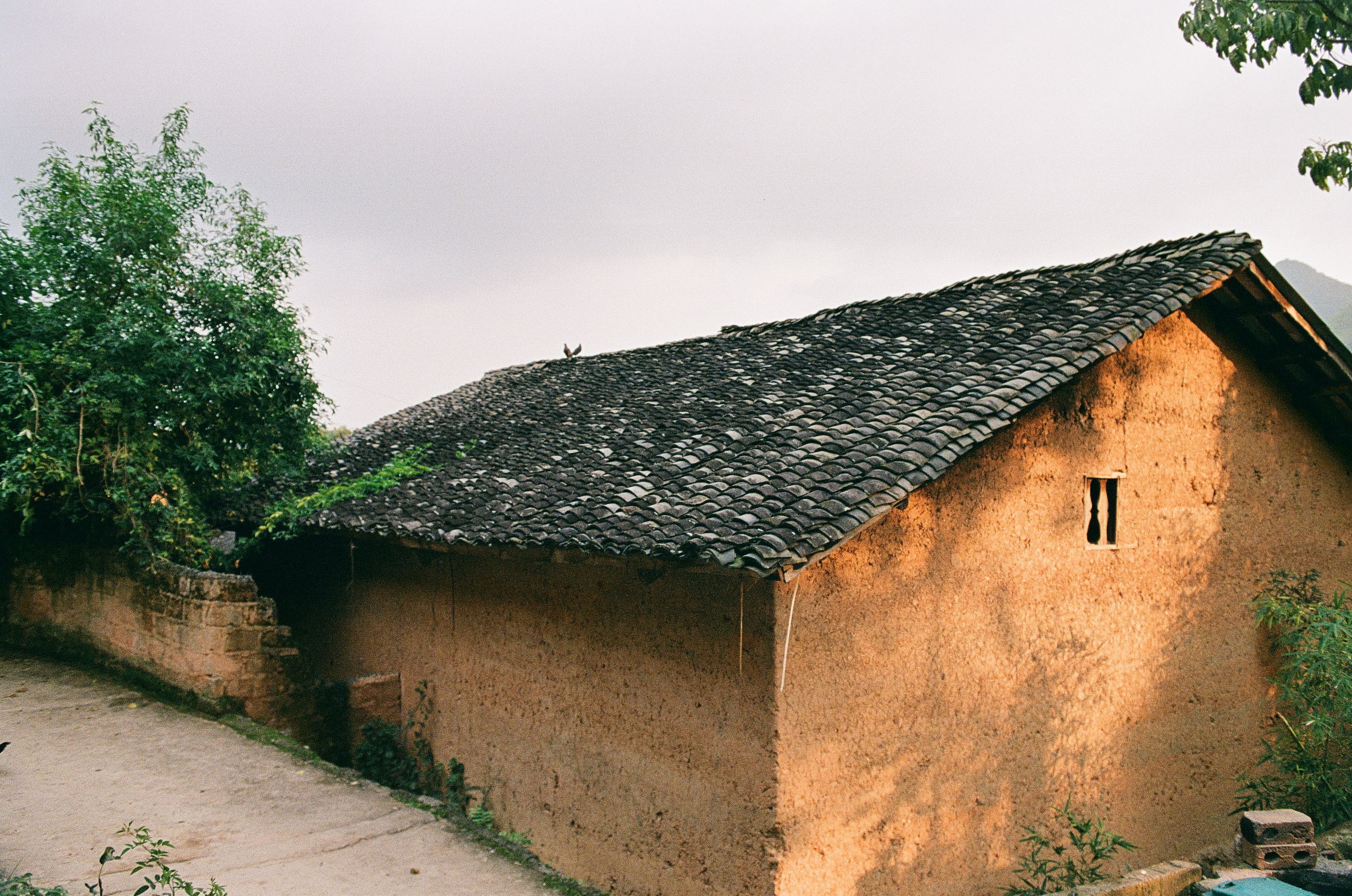 a beautiful clay tile or slate roof - how long do residential roofs last