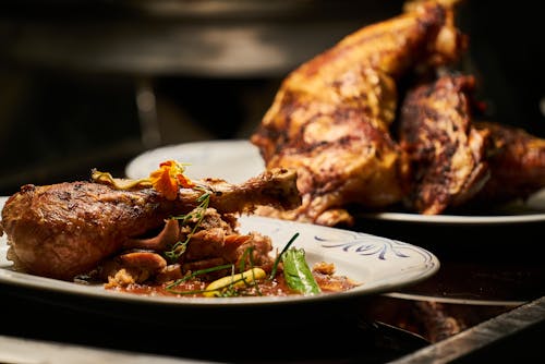 Free Cooked Chicken on White Plate Stock Photo