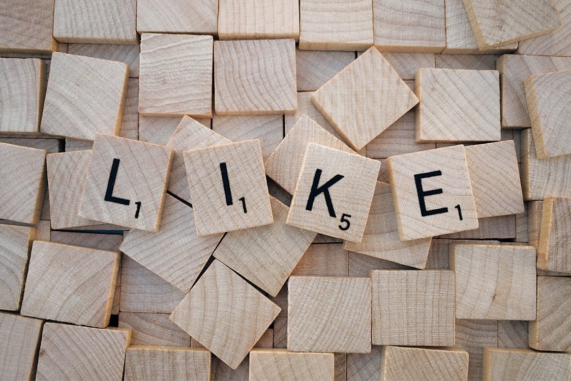 Free Like Printed on Brown Wooden Scrabble Stock Photo social media