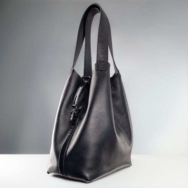 A compact handbag against a white studio background — photo by José Martin Segura Benites on Pexels