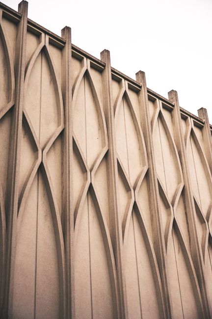 Close-up view of a modern architectural wall in Seattle featuring intricate geometric patterns.