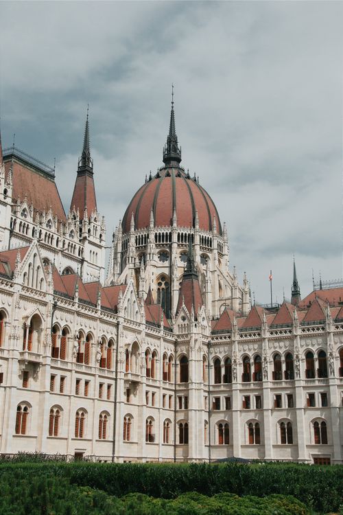 Free Captivating architecture of the Hungarian Parliament Building in Budapest under a cloudy sky. Stock Photo