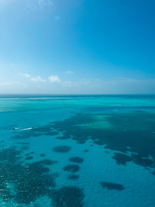 Free Stunning aerial view of turquoise waters and blue skies over San Andrés, Colombia. Stock Photo