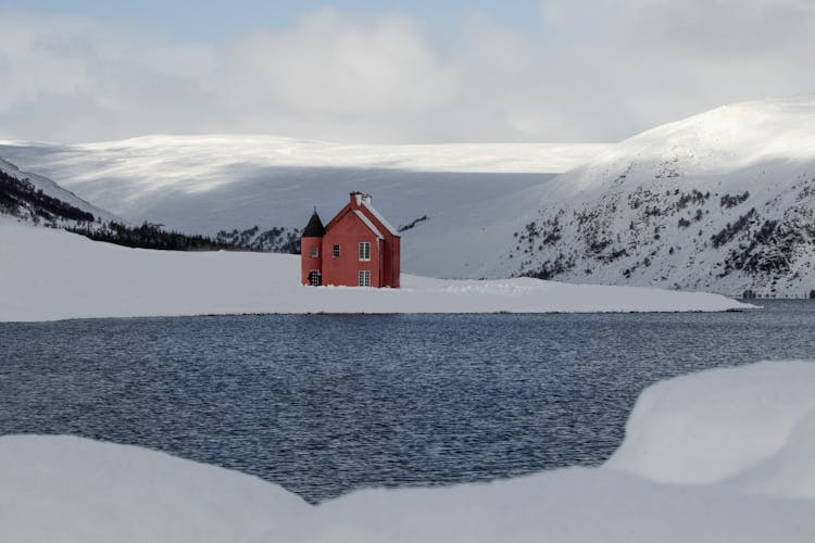 House By Loch Glass In Winter 