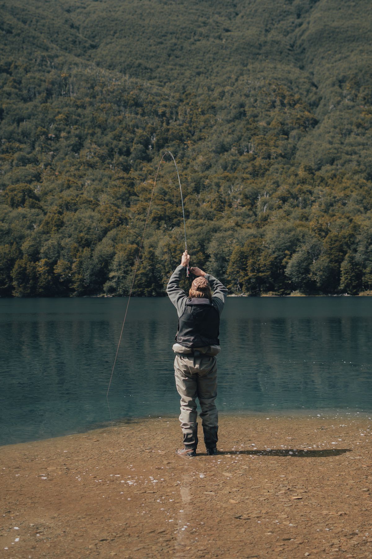 Fishing at mountain reservoir