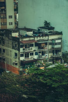 A rustic residential building with balconies in Kuala Lumpur, Malaysia, showcasing urban architecture.