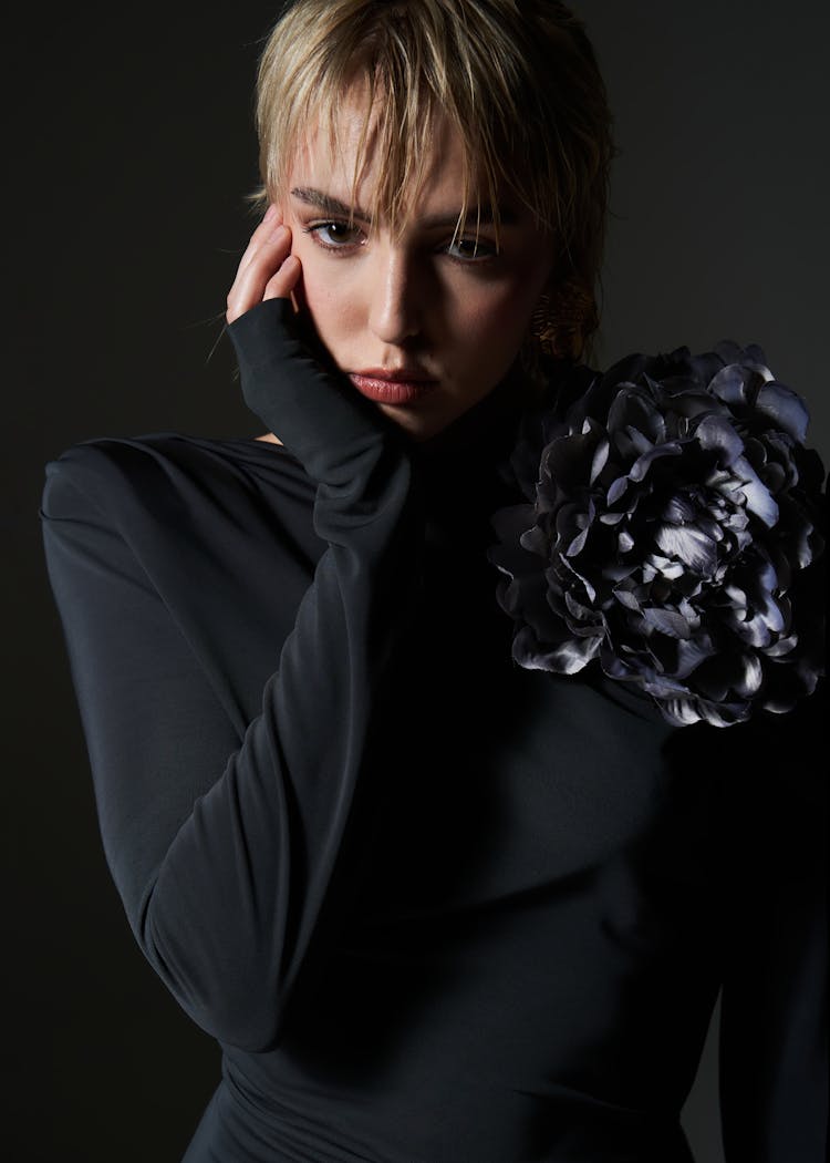 Studio Shot Of A Young Woman Wearing A Black Dress