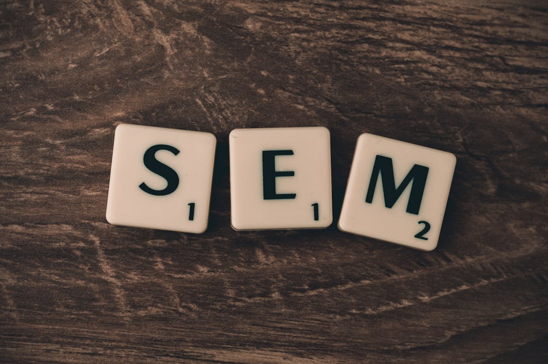 Free Three White S, E, and M Scrabble Tiles Stock Photo