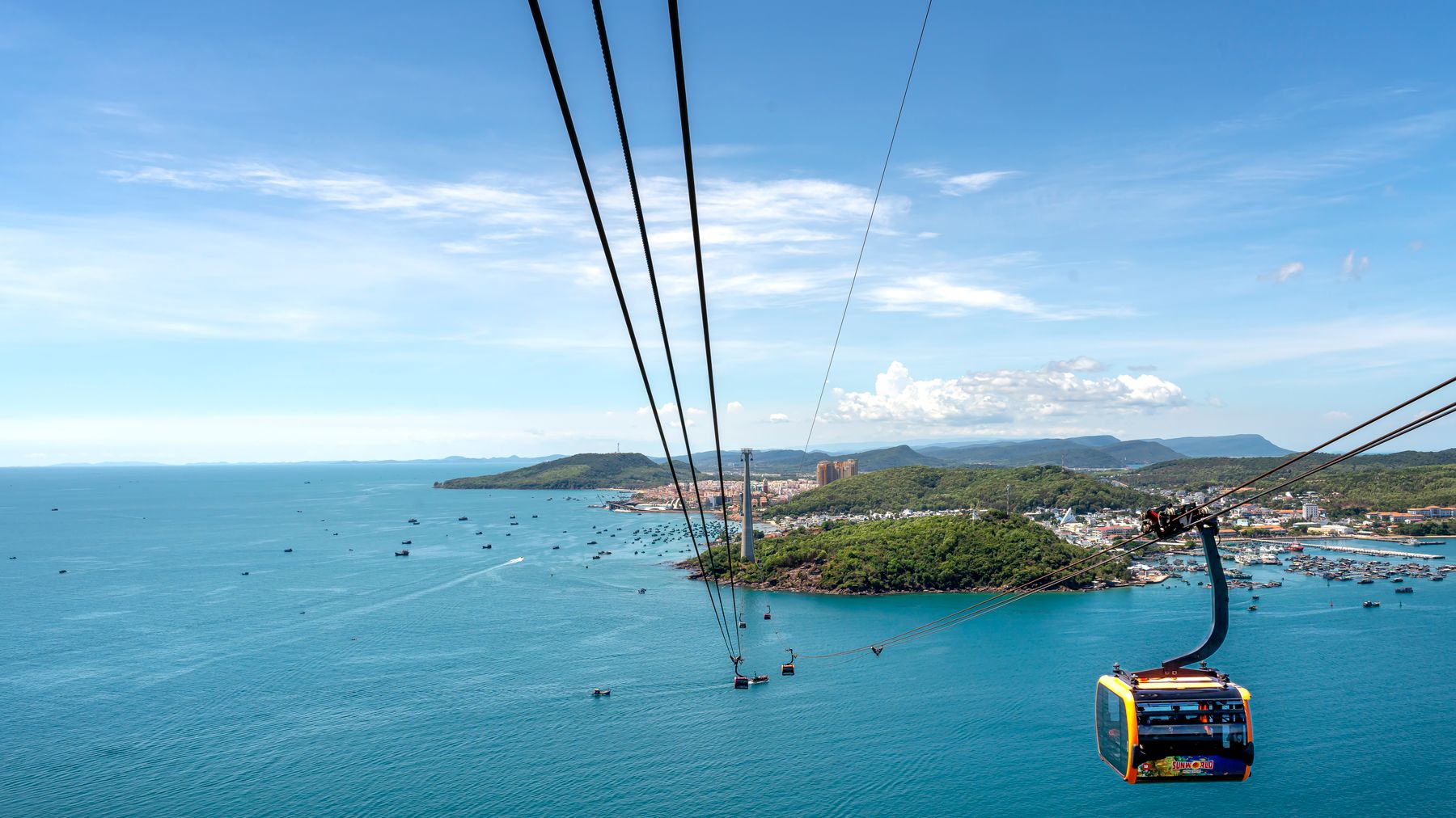A breathtaking view of Hon Thom Cable Car over the turquoise sea and lush islands in Vietnam.