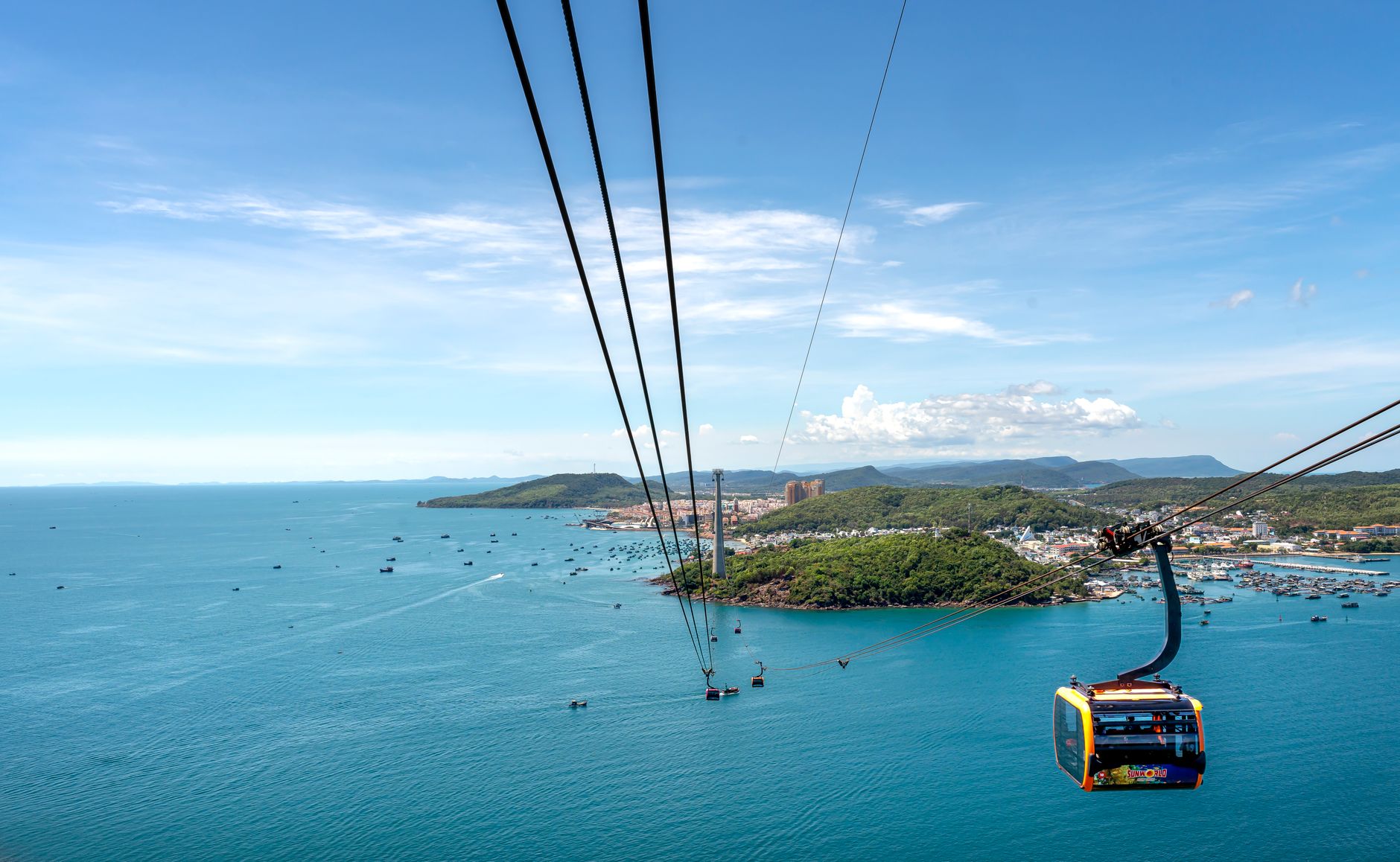 A breathtaking view of Hon Thom Cable Car over the turquoise sea and lush islands in Vietnam.