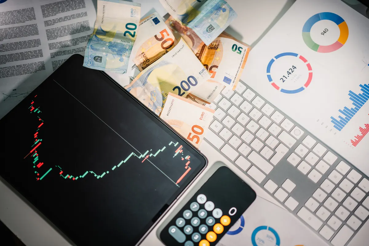 Stock charts displayed on a tablet screen for business and economic analysis.