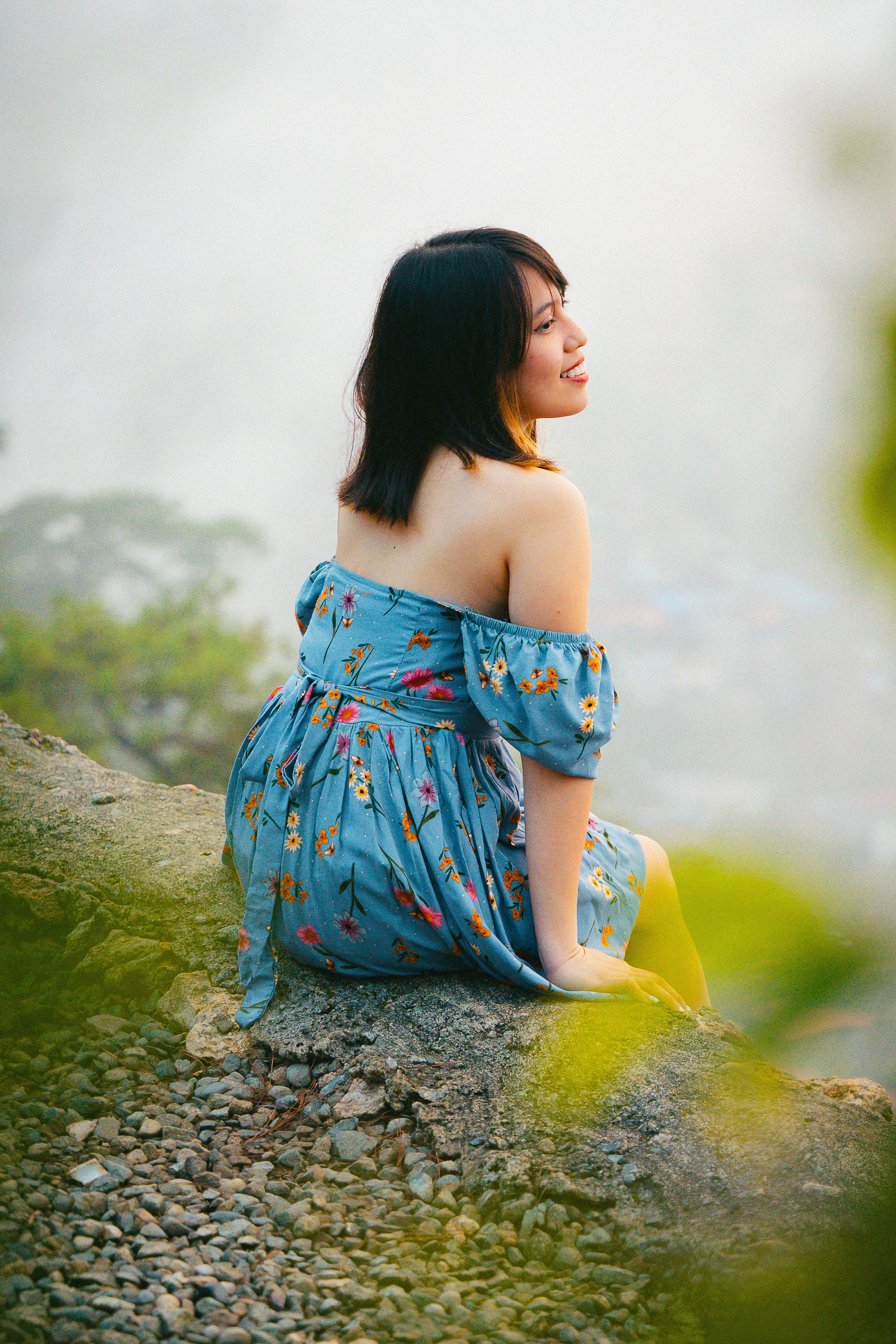 Woman in Dress Sitting on Rock · Free Stock Photo