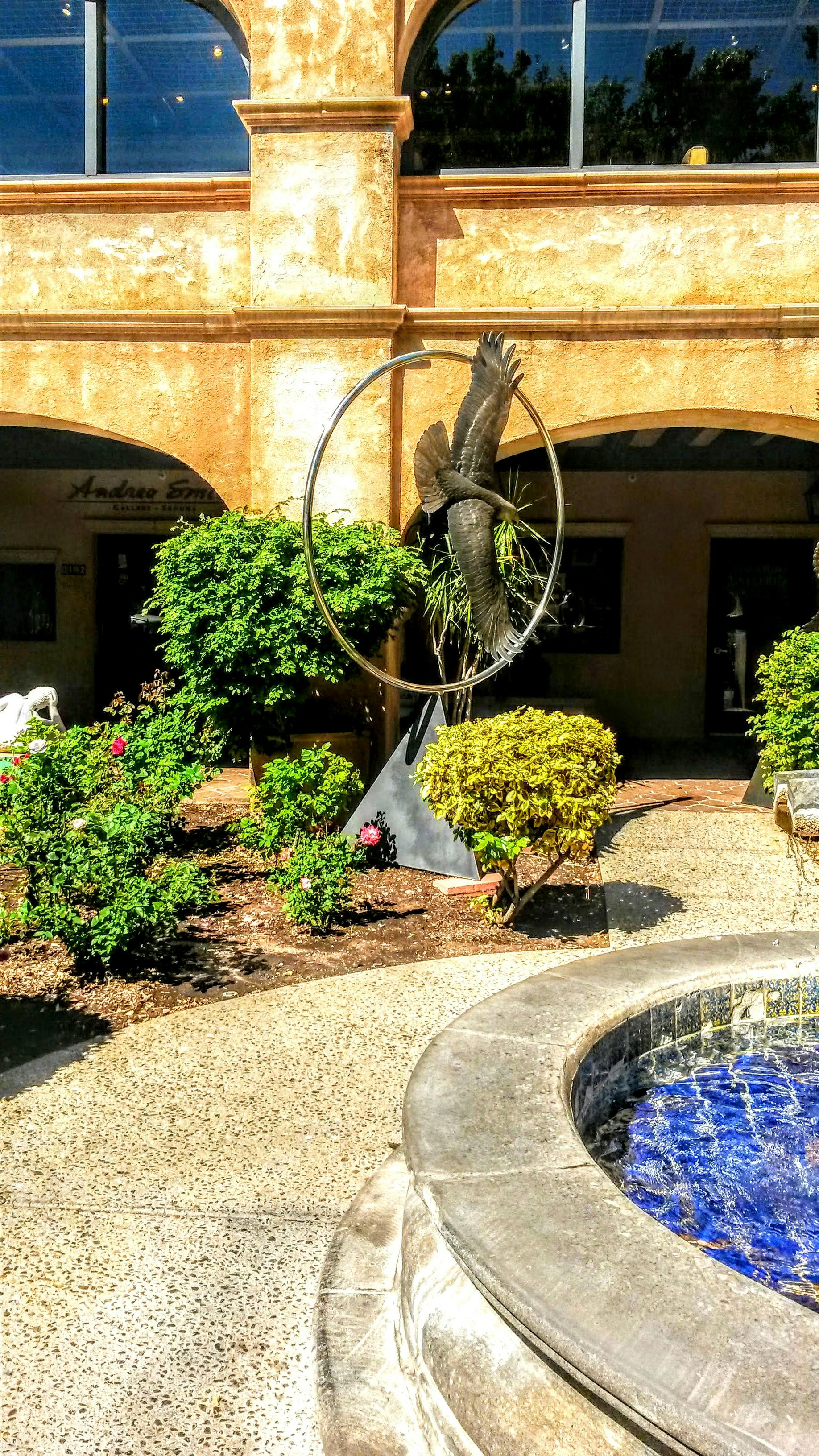 Multiple people collaborating with laptops showing graphs and analytics