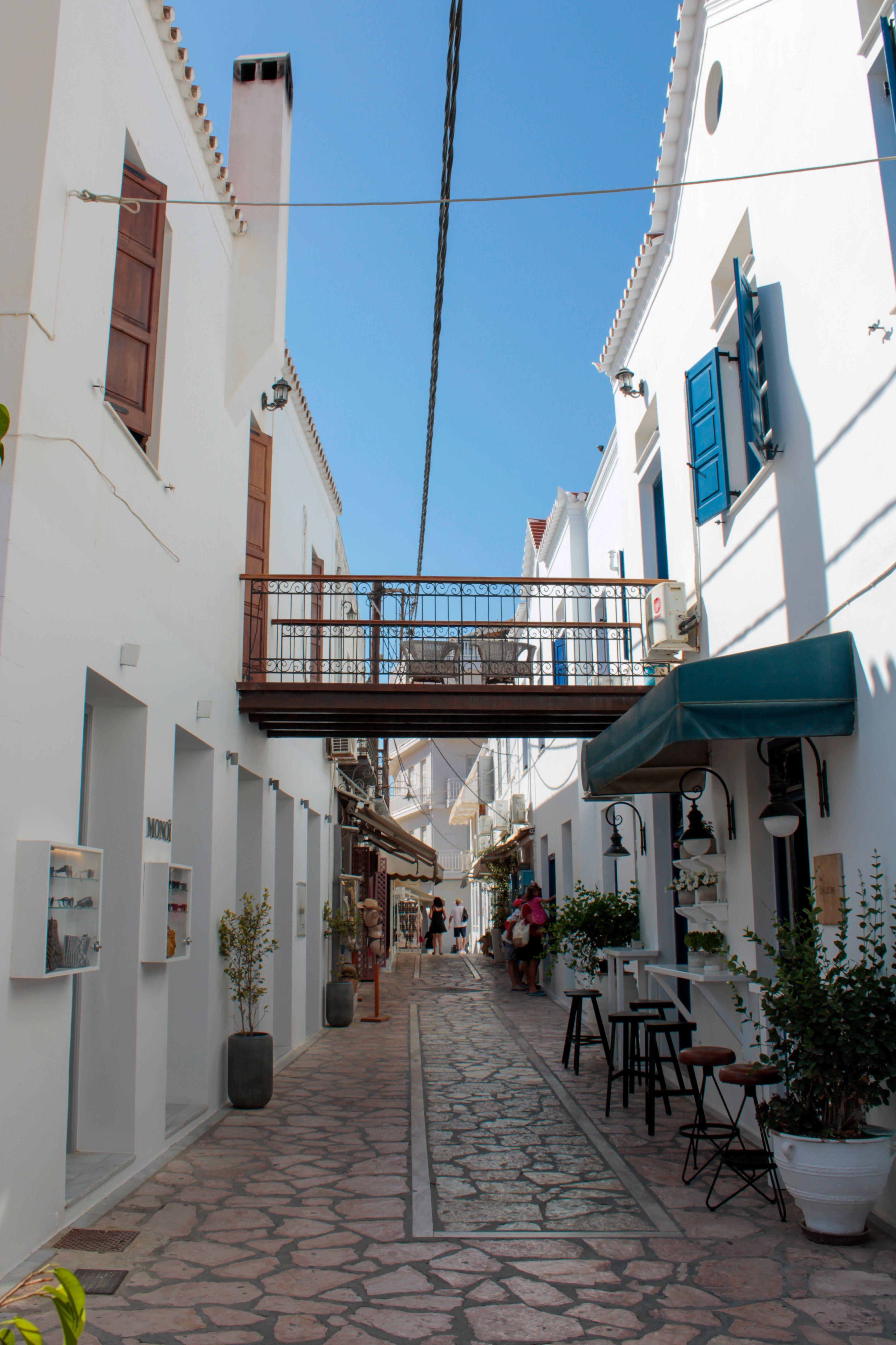 Narrow whitewashed lane with a footbridge in Spetses