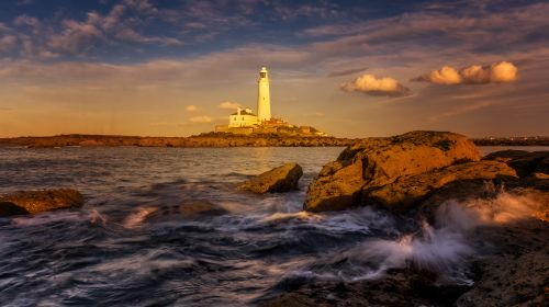 Free Beautiful scenic seascape with St Mary's Lighthouse during sunset. Stock Photo