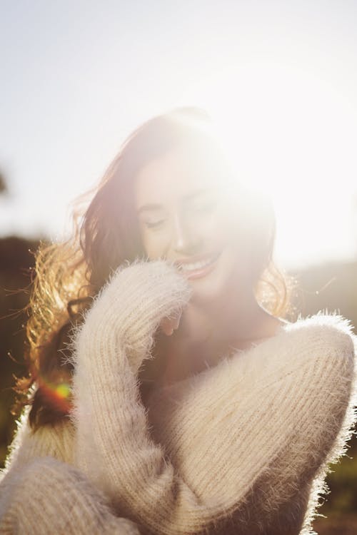 Photo of Woman Wearing White Sweater