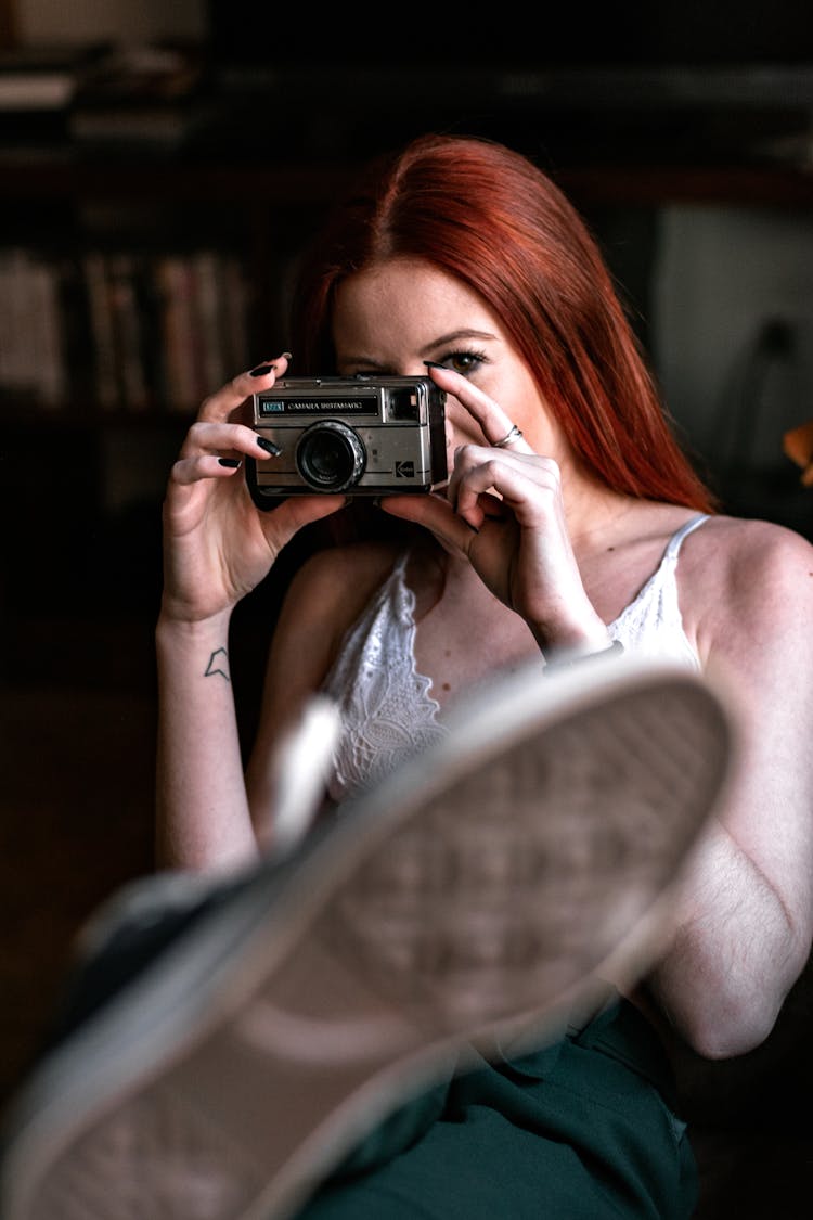 Photo Of Woman Holding An Old Camera