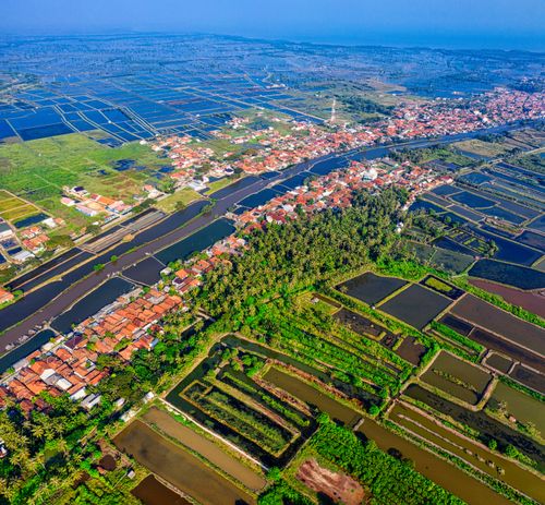 Free A breathtaking aerial view of rural farmland and residential area in Banten, Indonesia. Stock Photo