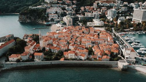 Free Stunning aerial view of Budva Old Town with its historic architecture and seaside charm. Stock Photo