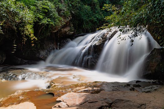 Beautiful long exposure of a waterfall in Chiang Mai, Thailand's lush forests.